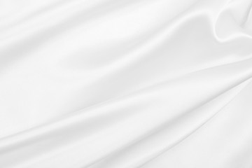 Smooth elegant white silk or satin luxury cloth texture as wedding background. Luxurious background design