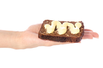 Piece of bread with sauce mayonnaise in hand on white background isolation
