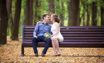 Fototapeta premium young man and woman on a walk in a park, happiness