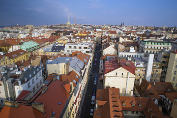 Fototapeta premium Top view of the red roofs, panorama of the city of Prague Czech Republic.