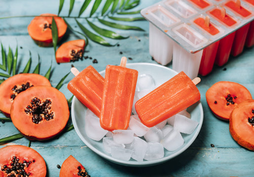 Homemade papaya ice lollies