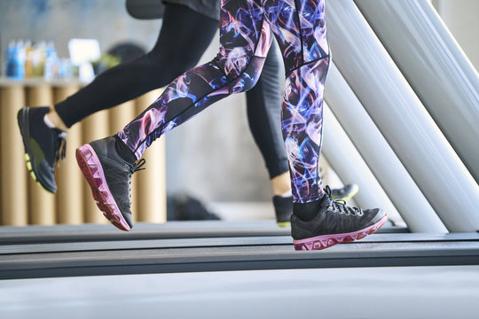 Close-up of people running on treadmill at gym - Powered by Adobe