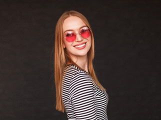 Trendy blond model in sunglasses