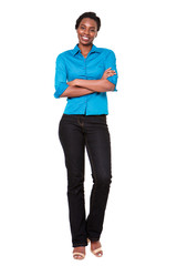 Full length smiling african american woman standing with arms crossed on white background