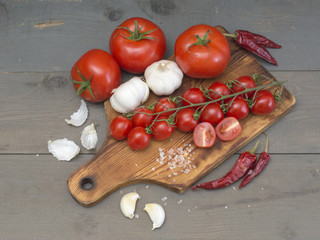 tomatoes on a wooden table. 
