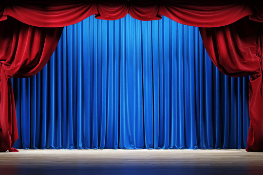 Theater stage with red and blue velvet curtains