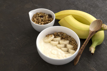 Natural homemade yogurt with muesli and banana.