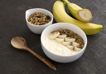 Natural homemade yogurt with muesli and banana.