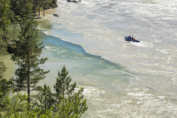 Merging of rivers. Mountain landscape with a water stream in Altai, Siberia, Russia