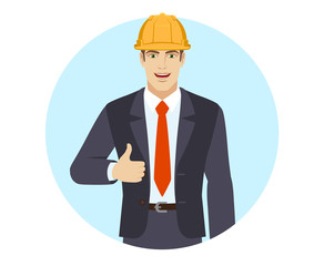 Businessman in construction helmet holding briefcase and showing thumb up