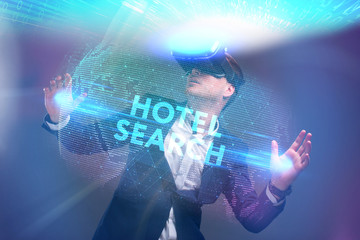 Business, Technology, Internet and network concept. Young businessman working in virtual reality glasses sees the inscription: Hotel search