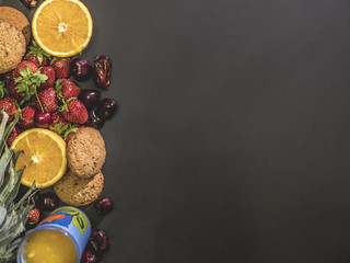 overhead flat lay of sweet low diet launch food concept on black surface copy space