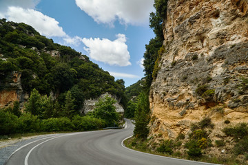 Asphalt road in a rocky ravine on the island of Crete.