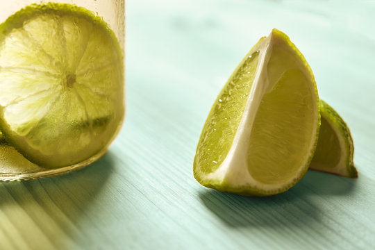 slices of lemon and lemonade on a turquoise wood