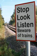 Stop Look Listen Beware of trains sign