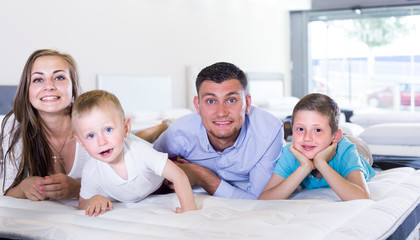 Family of four are testing quality of mattress