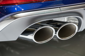 Chrome exhaust pipes on a sports car