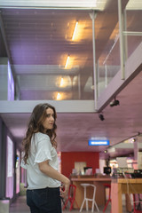 beautiful long-haired woman looking back