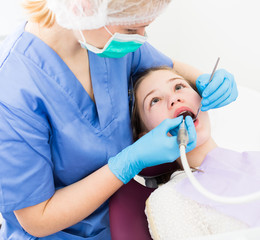 Girl getting dental treatment