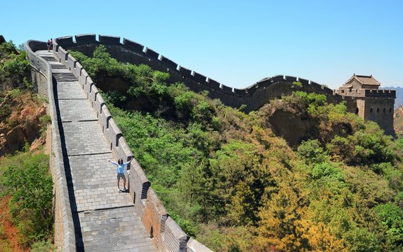 woman hiker with open arms on Great Wall