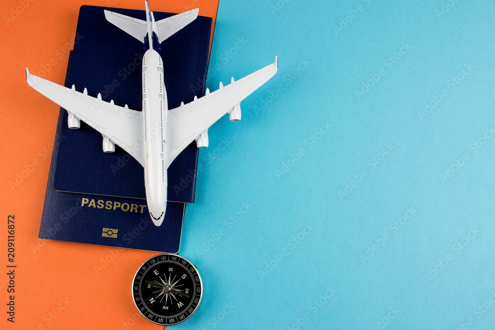 Poster travel concept with plane and passport on color paper background. copy space for text and design