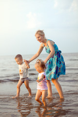 Happy family playing on the beach