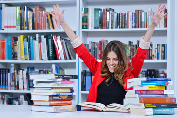 Beautiful female student in a university library