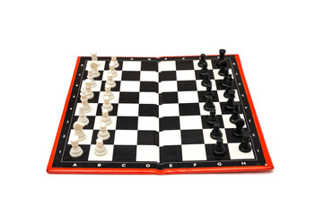 Mini compact portable chess with small figures on a white background