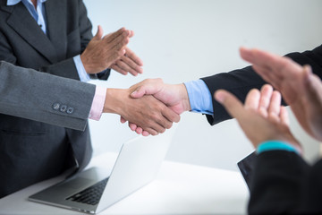 Business Team shaking hands to seal a deal with partner agreement was signed co-investment business.business managers team working with new startup project in office room. Selective focus.