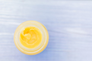 A jar with balm, cream.