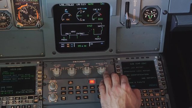 The cockpit of the aircraft. The pilot checks the electronics of the aircraft. Preparation of a passenger airliner for takeoff. The pilot checks the plane for flight. 4k