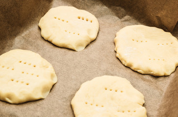 Home handmade baking, the dough on parchment paper for baking