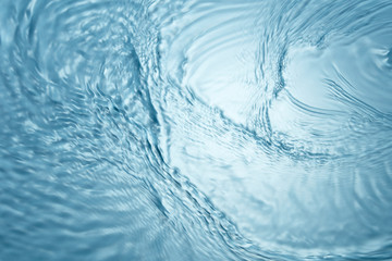 Background of blue clear water in motion with waves