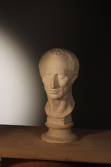 Fototapeta na wymiar Caesar's plaster head in studio of Moscow, Russia, October 8, 2014