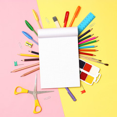 set of stationery on a colored background with space for text. back to school. office tools. flat lay, top view