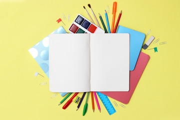 Fototapeta premium set of stationery on a colored background with space for text. back to school. office tools. flat lay, top view