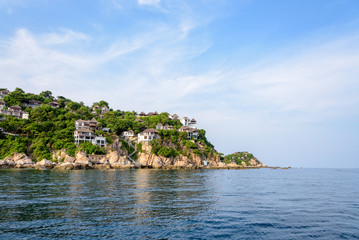 Fototapeta na wymiar Beautiful nature landscape of villa on Shark Cape, Shark Bay area under the blue sky on the sea during summer at Ko Tao island is a famous tourist attractions in the Gulf of Thailand, Surat Thani