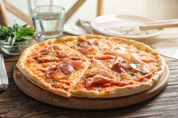 Delicious hot pizza with meat on table