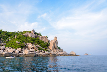 Fototapeta na wymiar Beautiful nature landscape group exotic rock of Buddha Point at cape near John-Suwan viewpoint under the blue sky on the sea during summer, Ko Tao island is a attractions in Surat Thani, Thailand