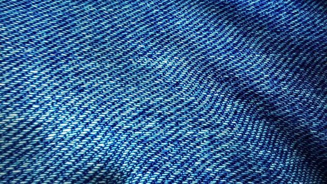 Blue background, denim jeans background. Jeans texture, fabric. texture of the material from the color of dark blue jeans with patches