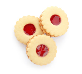 Traditional Christmas Linzer cookies with sweet jam on white background