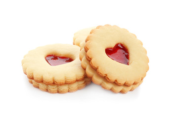 Traditional Christmas Linzer cookies with sweet jam on white background