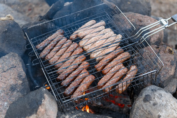 Sausage fire-roasted on the grill