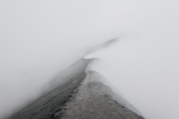 Misty path along the crater's rim