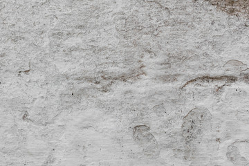 Wall fragment with scratches and cracks