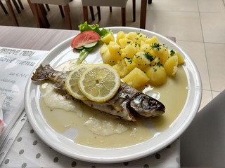 Trout fish, potatoes and lemon on the plate. Slovakia