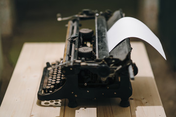 typewriter with paper sheet. Space for your text
