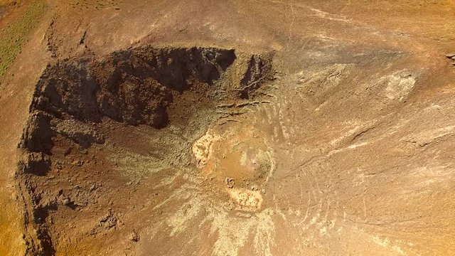 Aerial view of an arid landscape at Caldera de Gairia volcano in Fuerteventura.