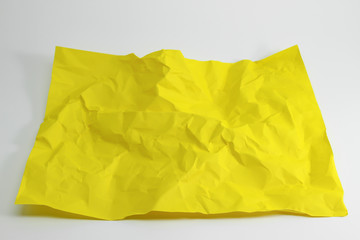 Fototapeta na wymiar crumpled yellow paper