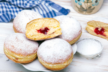 Traditional Polish donuts on wooden background.  Tasty doughnuts with jam. - 209129662